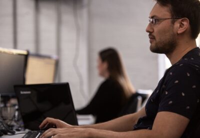 Man Looking Stoic at Desk